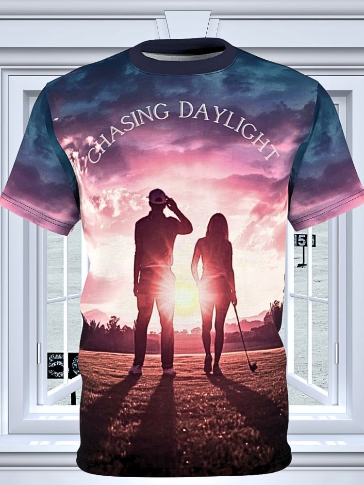 T-shirt with a sunset or sunrise scene of a man and woman walking on a golf course, with the words 'Chasing Daylight' written across the top.