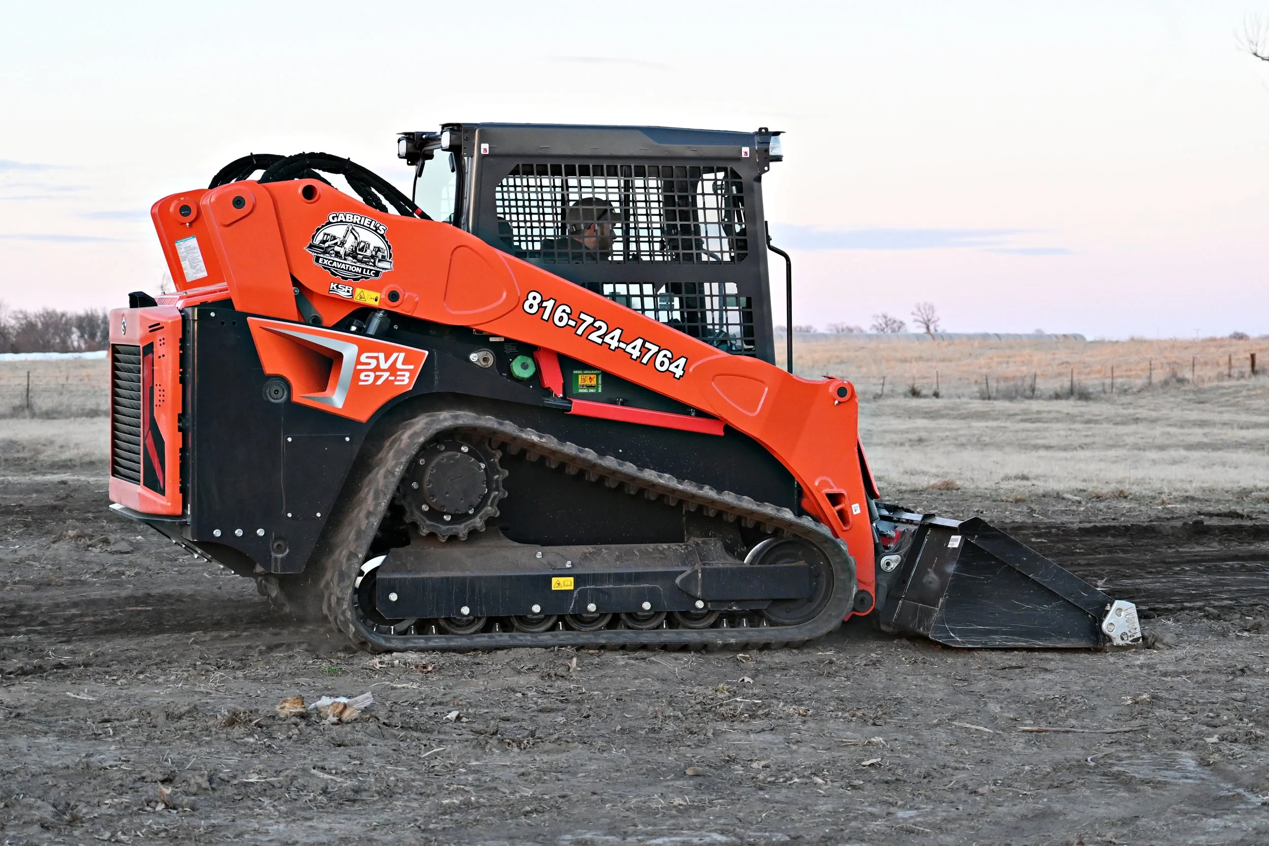 Gabriel's excavation skid steer grades driveway in Cameron, Missouri.