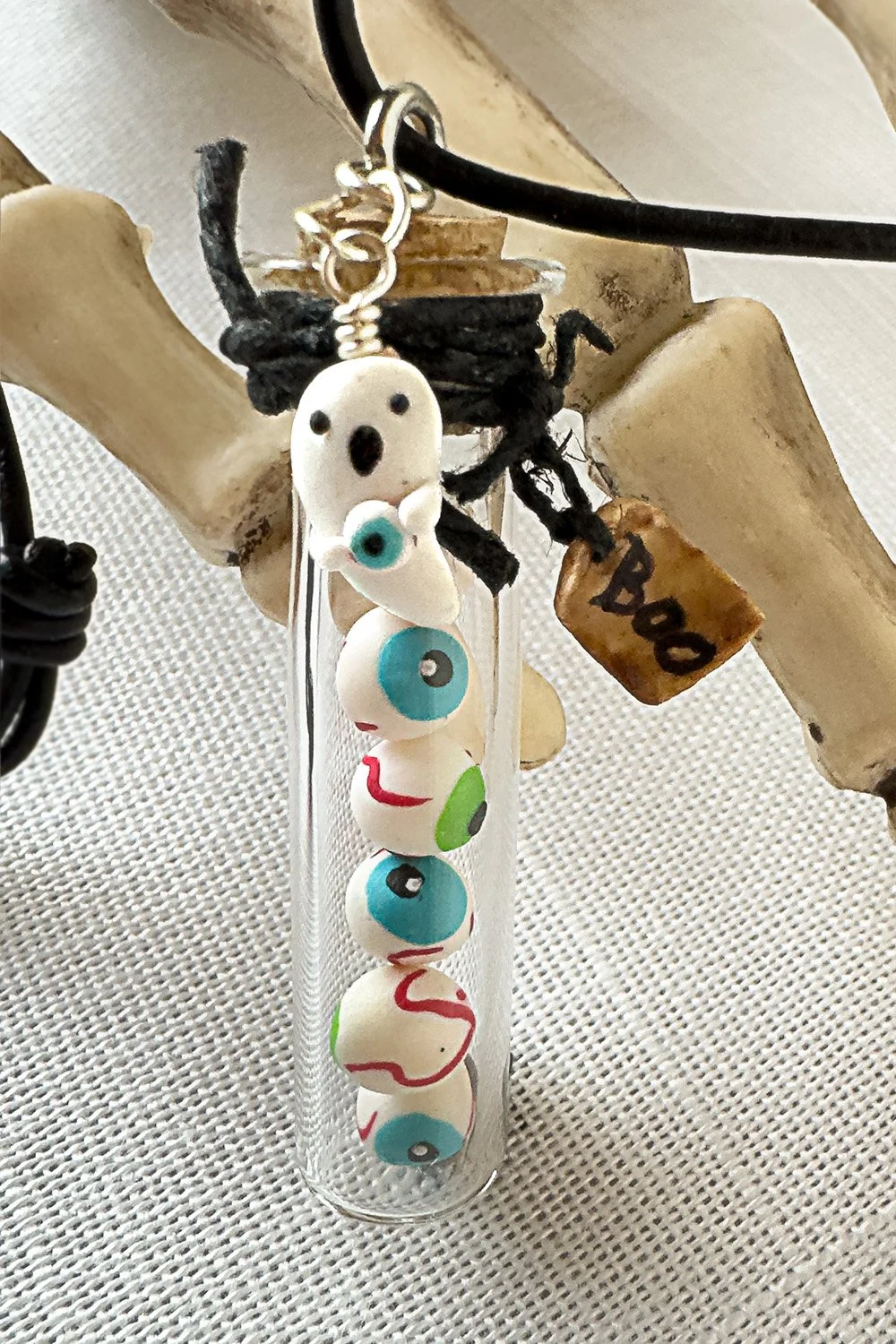 Halloween-eyeball-bottle-necklace-detail.jpg