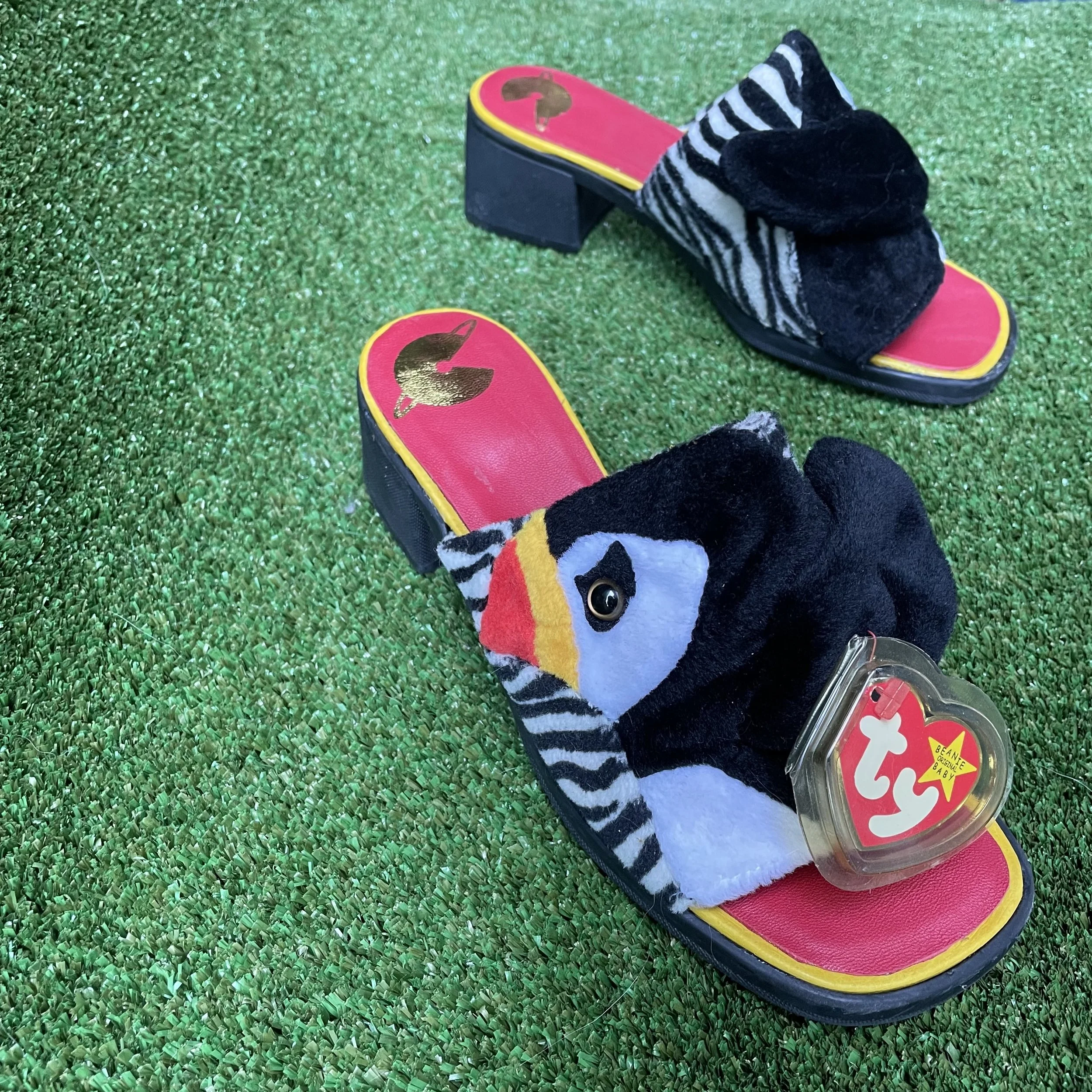 Beanie Baby Remix Slides - 
Footwear experiment repurposing plush toys into a reconstructed shoe upper.