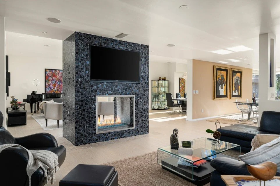 Luxury living room with mosaic fireplace and grand piano in McCormick Ranch, Scottsdale