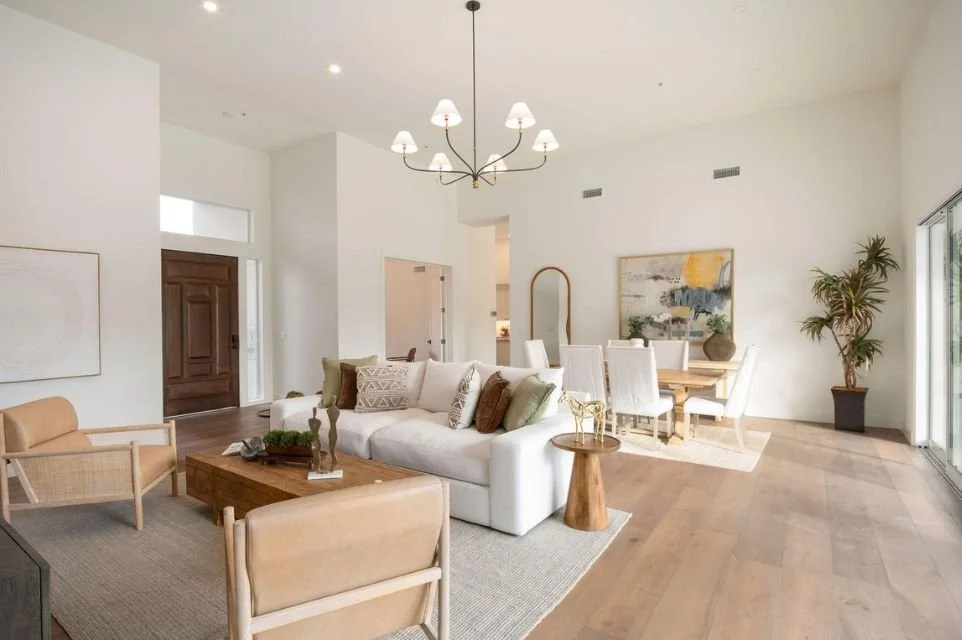 Living room at 11916 N 81st Street in Scottsdale Country Club, with vaulted ceilings and wood flooring