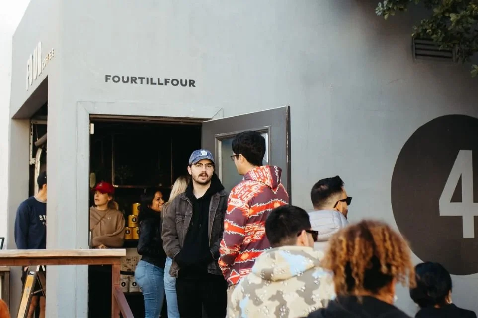 Visitors gathered outside FourTillFour Café in Scottsdale, Arizona, a popular destination for Porsche enthusiasts, Cars & Coffee events, and the local automotive community.