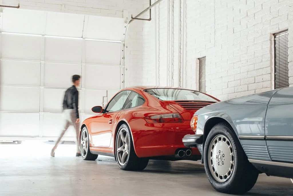 Red Porsche 911 and classic Mercedes in Scottsdale garage, Wolfe Luxury Real Estate