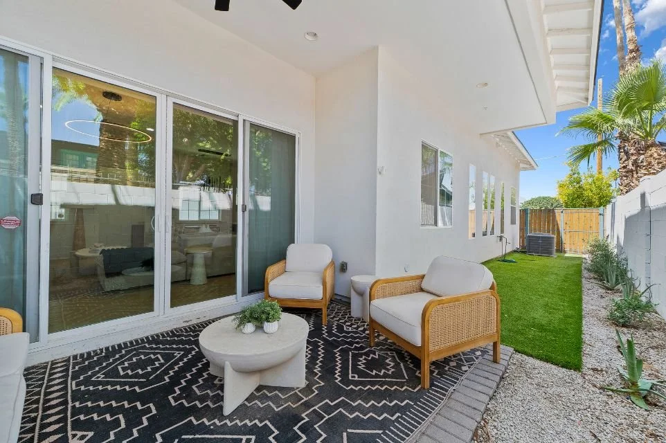 Private backyard patio at 4017 N 40th Street in Arcadia Lite Phoenix featuring covered outdoor seating and landscaped yard