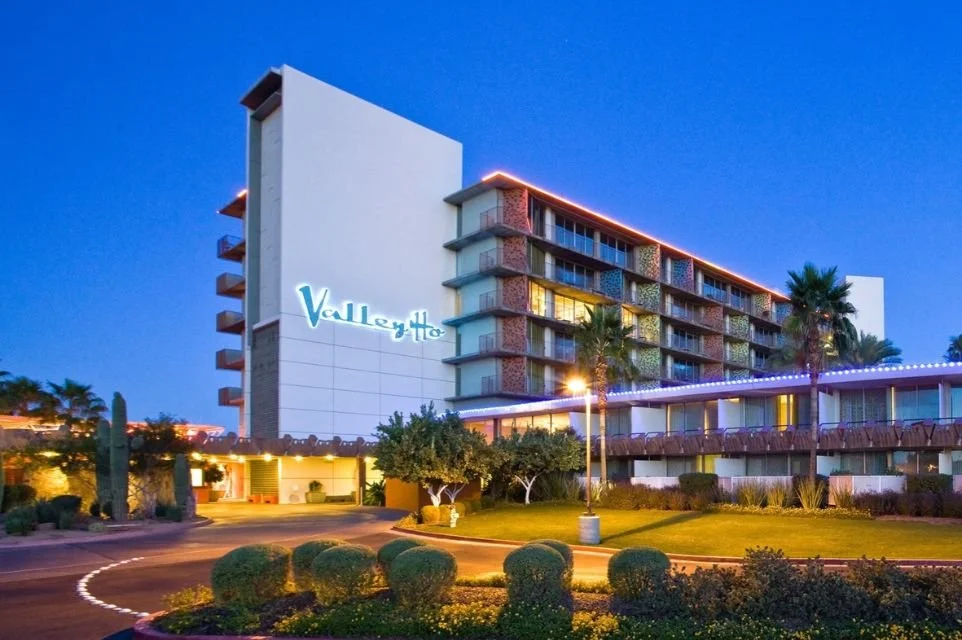 Hotel Valley Ho exterior illuminated at dusk, showcasing the iconic mid-century modern luxury hotel in Old Town Scottsdale.