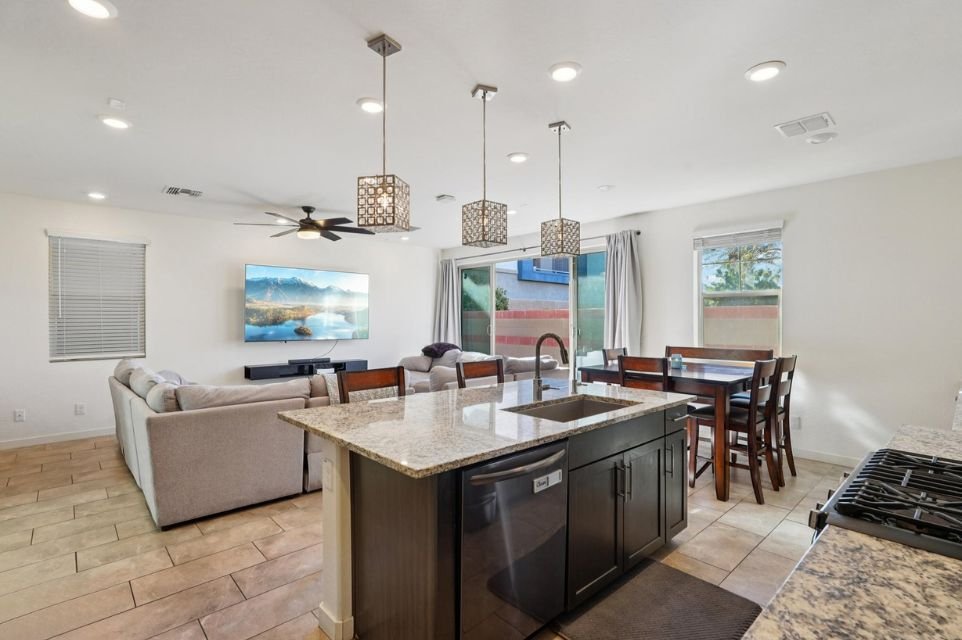 Open-concept kitchen, dining and living area at 17153 N 10th Street in Phoenix, Arizona