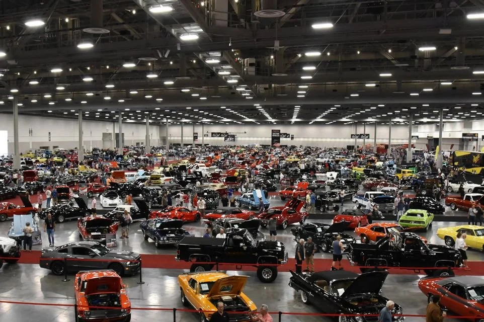 Collector cars on display at the Barrett-Jackson Scottsdale Auction featuring classic cars, muscle cars, and automotive enthusiasts.