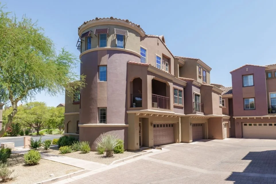 Private entrance and attached two-car garage at 3935 E Rough Rider Road in the gated Villages at Aviano community, Desert Ridge, Phoenix AZ.