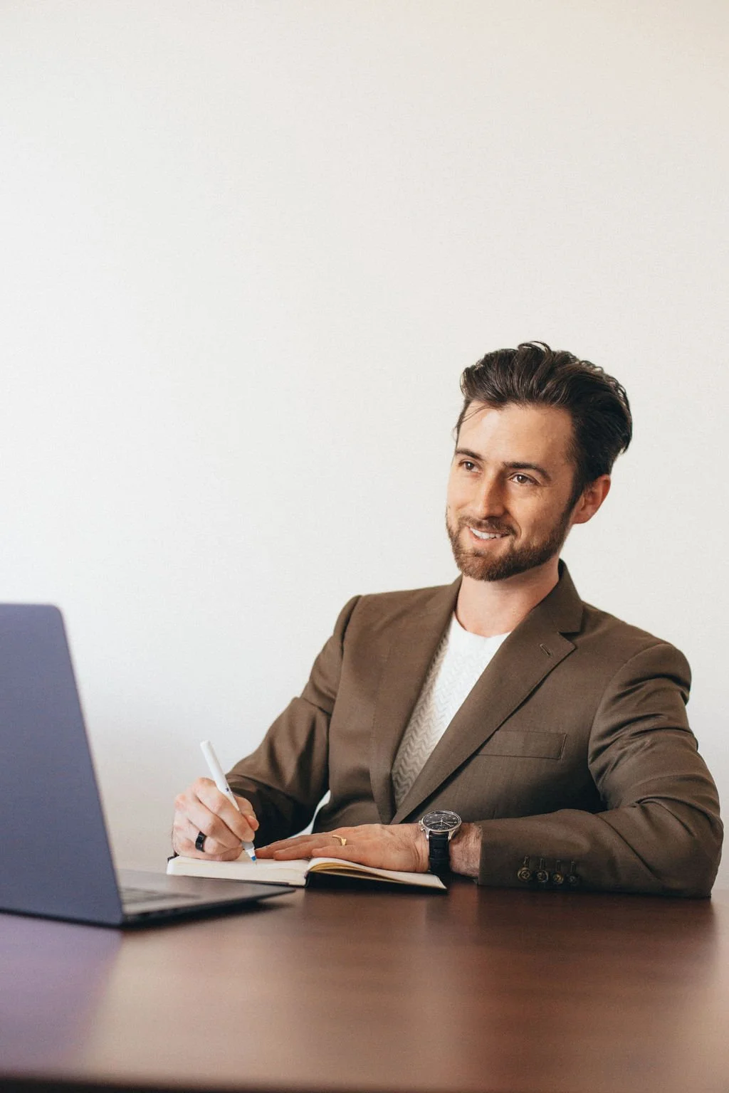 Cody Wolfe, luxury real estate agent in Scottsdale, working at desk