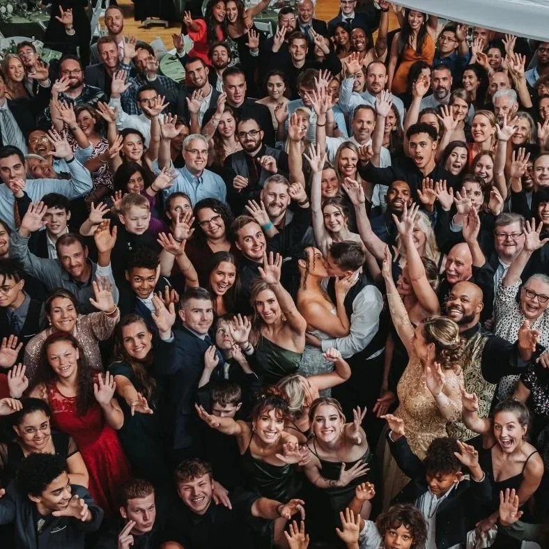 Guests dancing at luxury concierge wedding reception with custom wedding entertainment