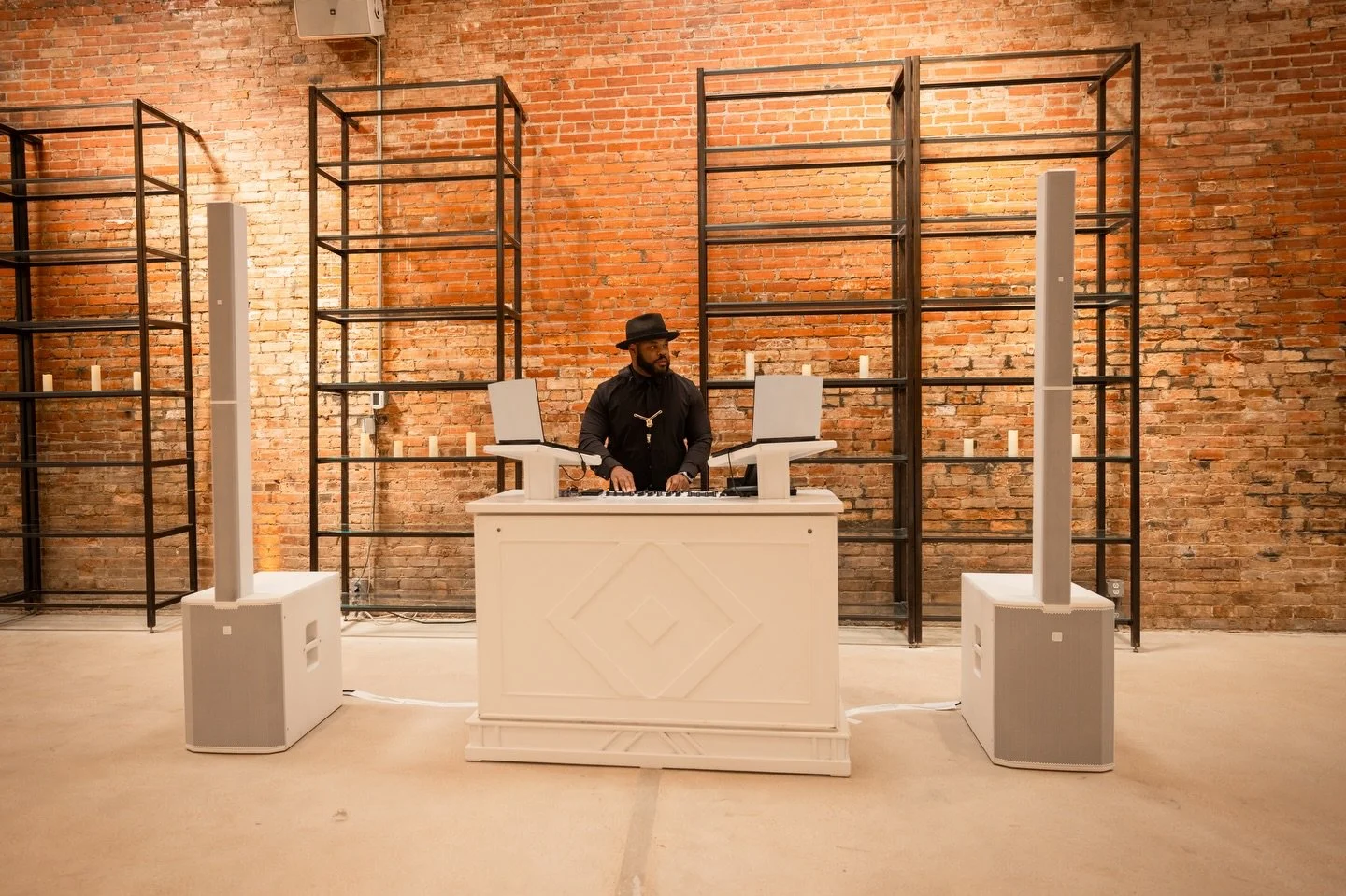 An elegant set up matters! Crisp white booth with speakers to match really allow for a seamless DJ set up!