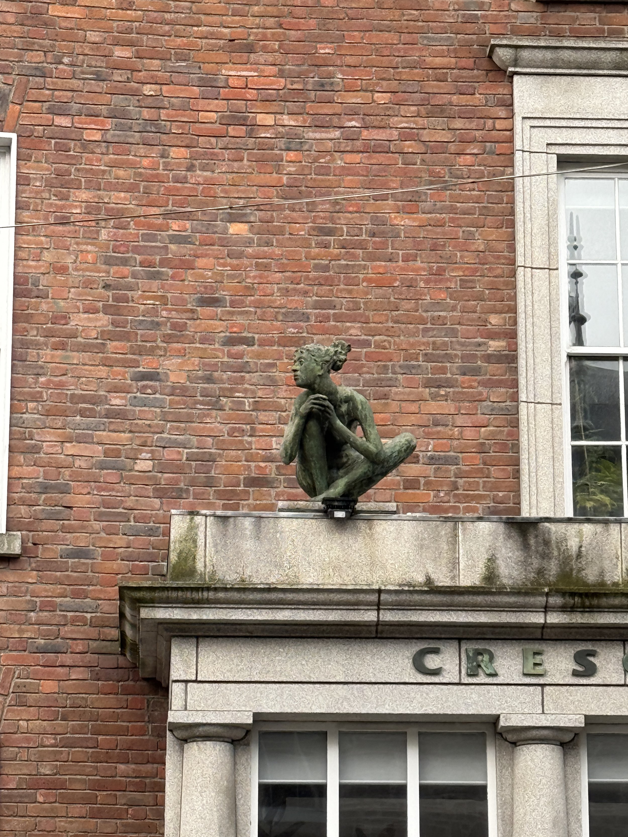 another angle of the crouched statue