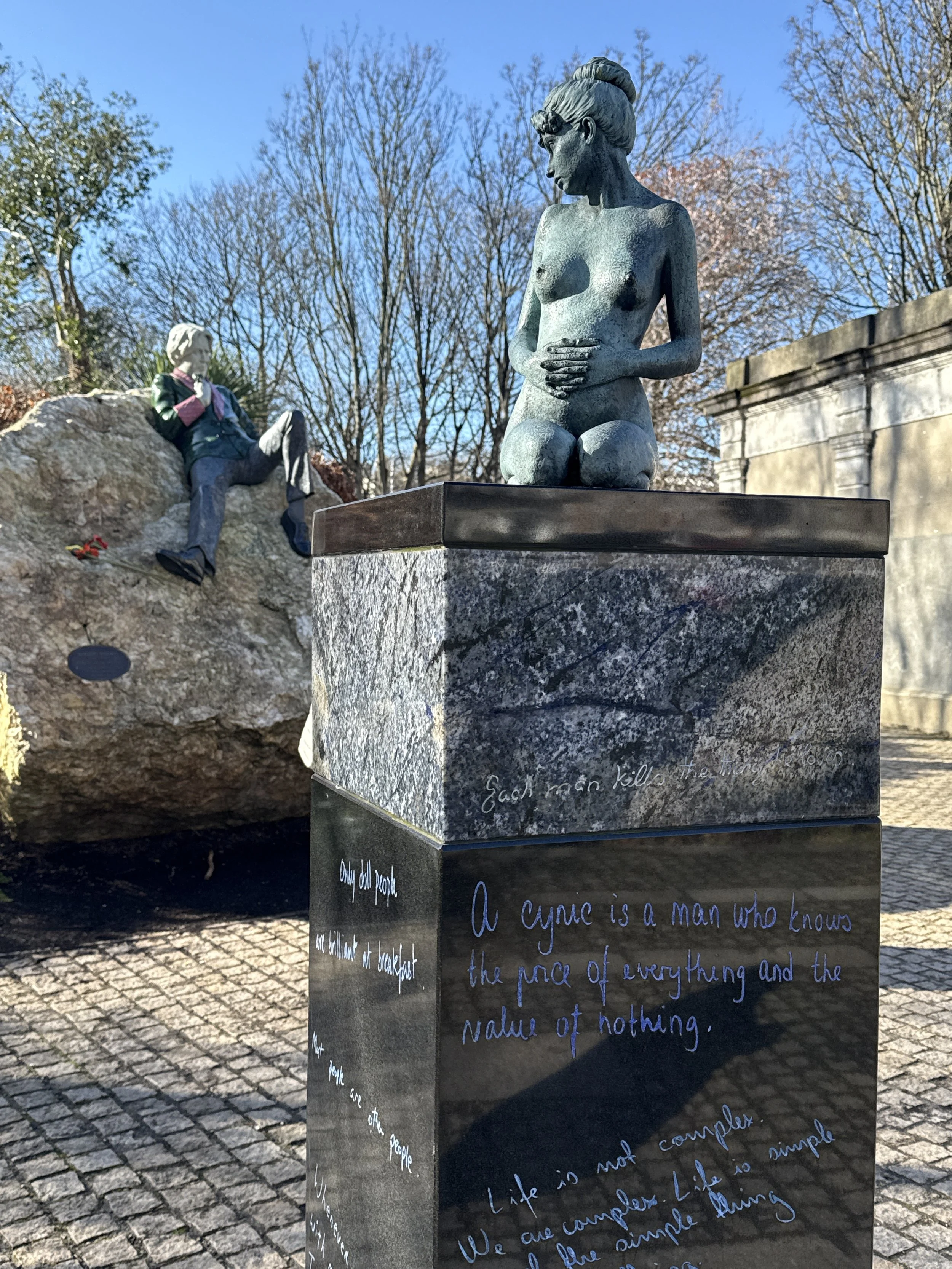 Statue beside oscar wilde statue much smaller