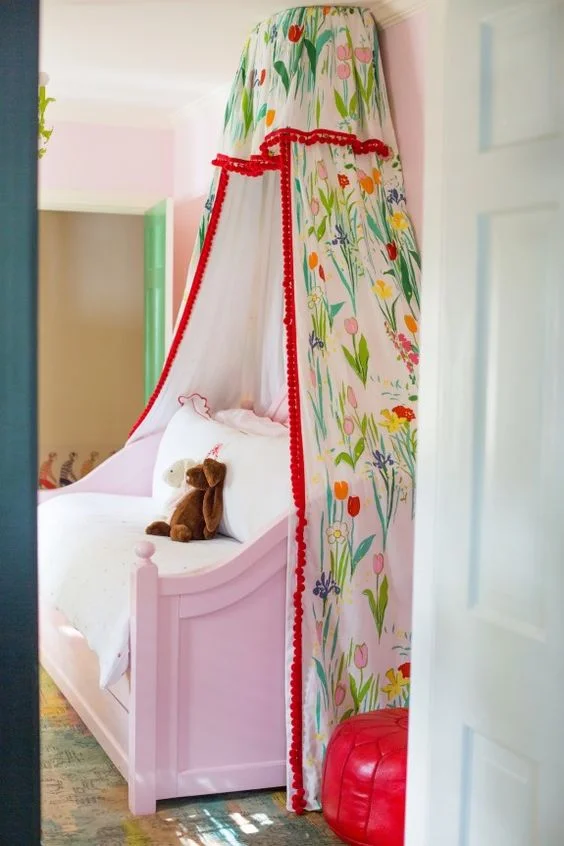 McCarthy's little girl's bed canopy is not the only Marrot print in the space. Nearby Marrot's "Feathers" print (below) hangs above the dresser. [Source: Peppermint Bliss]
