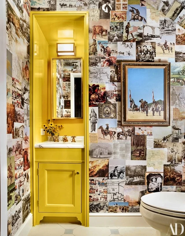 Pages from vintage western magazines and books adorn the walls of this powder bathroom. /Source: AD / Photo by Trevor Tondro Photography Inc.