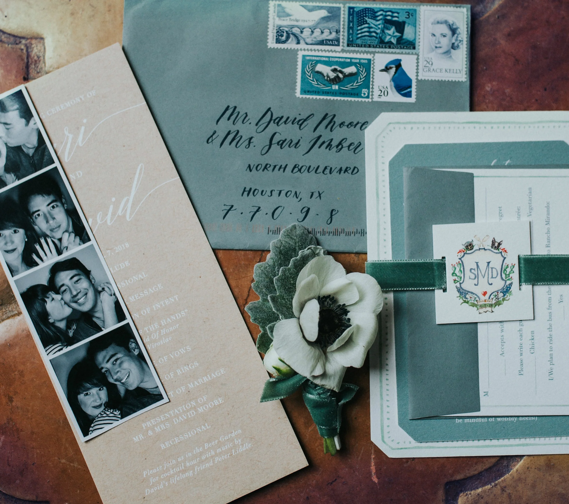 I had always dreamt of using a collection of vintage stamps. Michael pulled together the perfect blue grouping to adorn the sage, hand calligraphed envelopes.&nbsp;
