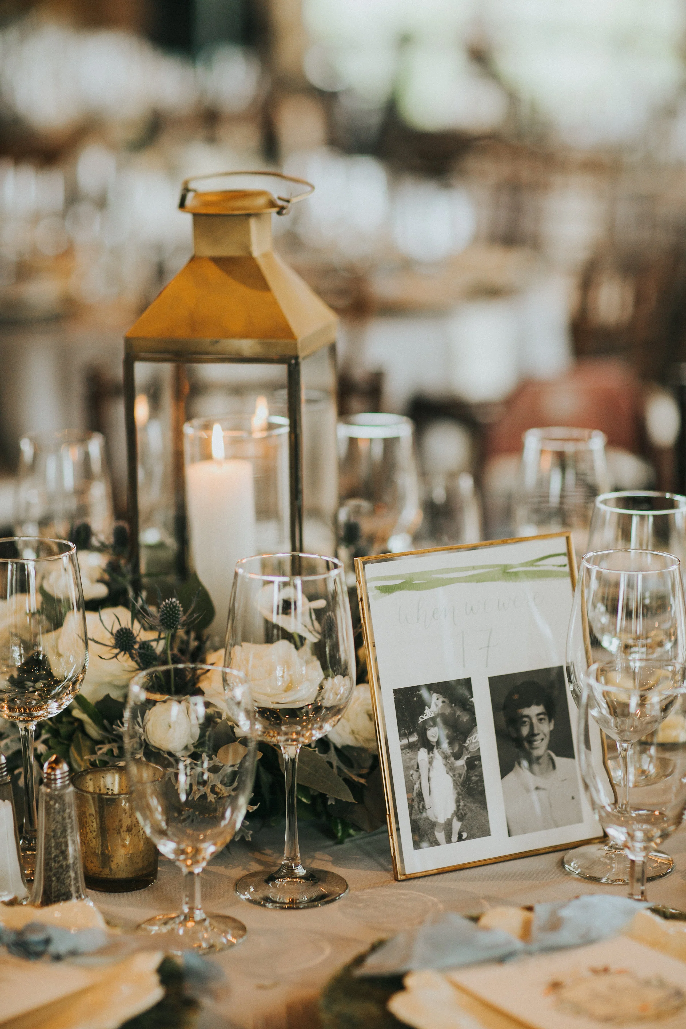 Every other table had a lantern with a floral wreath to bring more candlelit ambiance into the space. Table numbers made by Grace Art Market showcased photos of us from ages 1 to 20.