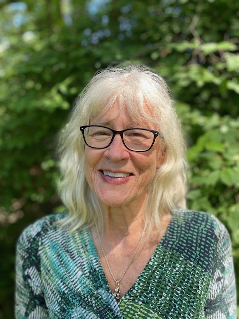 A textured orange surface with white streaks and scratches.