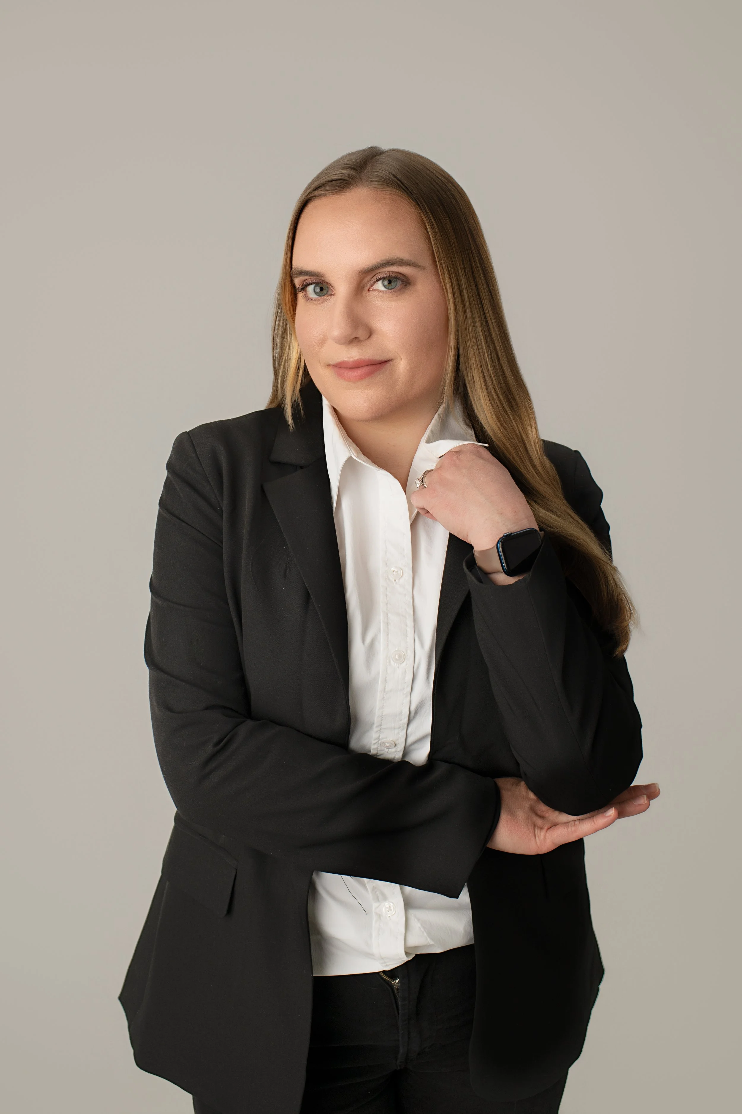 New Jersey Licensed Clinical social worker in a black suit with a white shirt, blonde hair and blue eyes