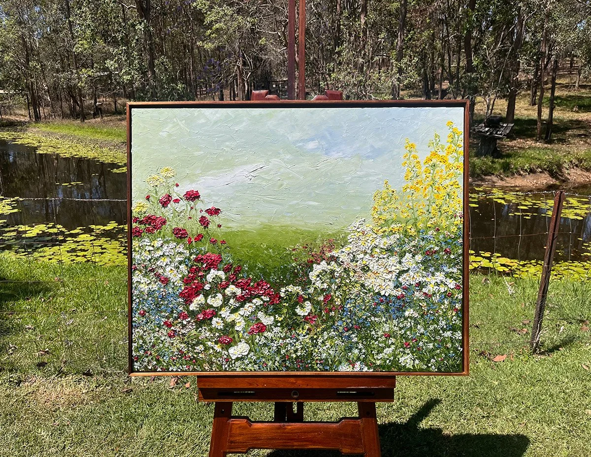 SOLD - 'Aromatic Abundance', 103 cm x 83 cm. Oil on linen in Blackwood frame.
Yellow snapdragons catch your eye but the red crimson dahlias take you on a journey. Blue forget me nots, white scabiosa and elegant cosmos reach and stretch across the fie
