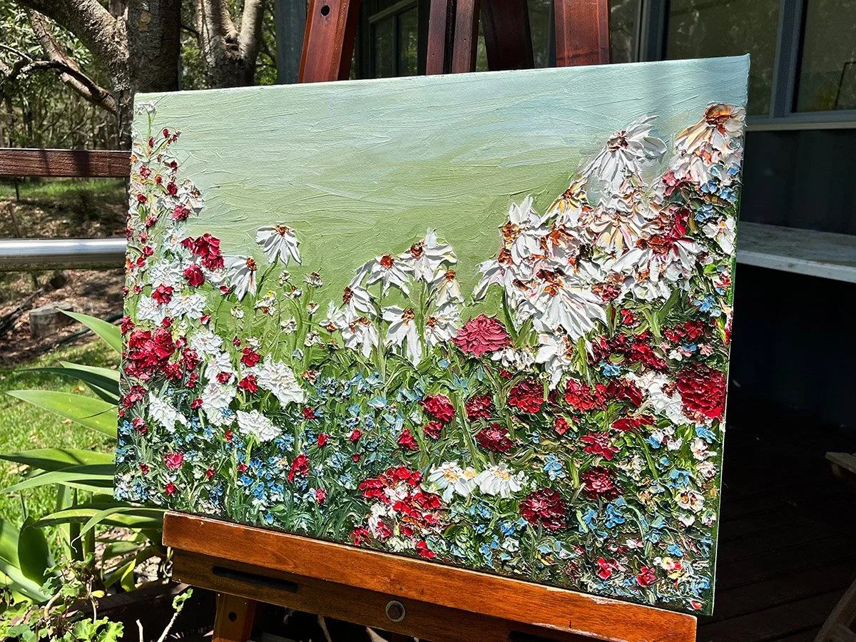 SOLD - 'Rewilding the Heart', 70cm x 50cm. Oil, framed in blackwood.
Beautiful crimson dahlias and stoic dancing cosmos bring this beautiful highly textured oil painting to life. Blue forget me nots are dotted throughout. Your eyes are taken on a jou