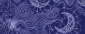 Intricate white paisley and floral pattern on a dark blue background
