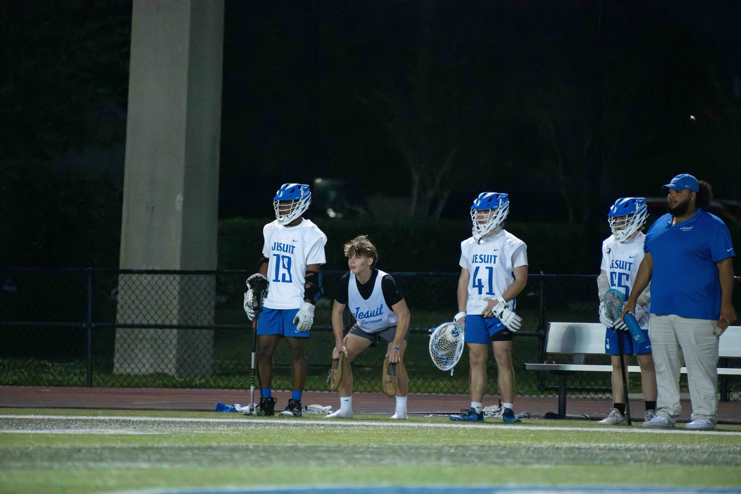 Run Out Jesuit Lacrosse Players L-5.jpg