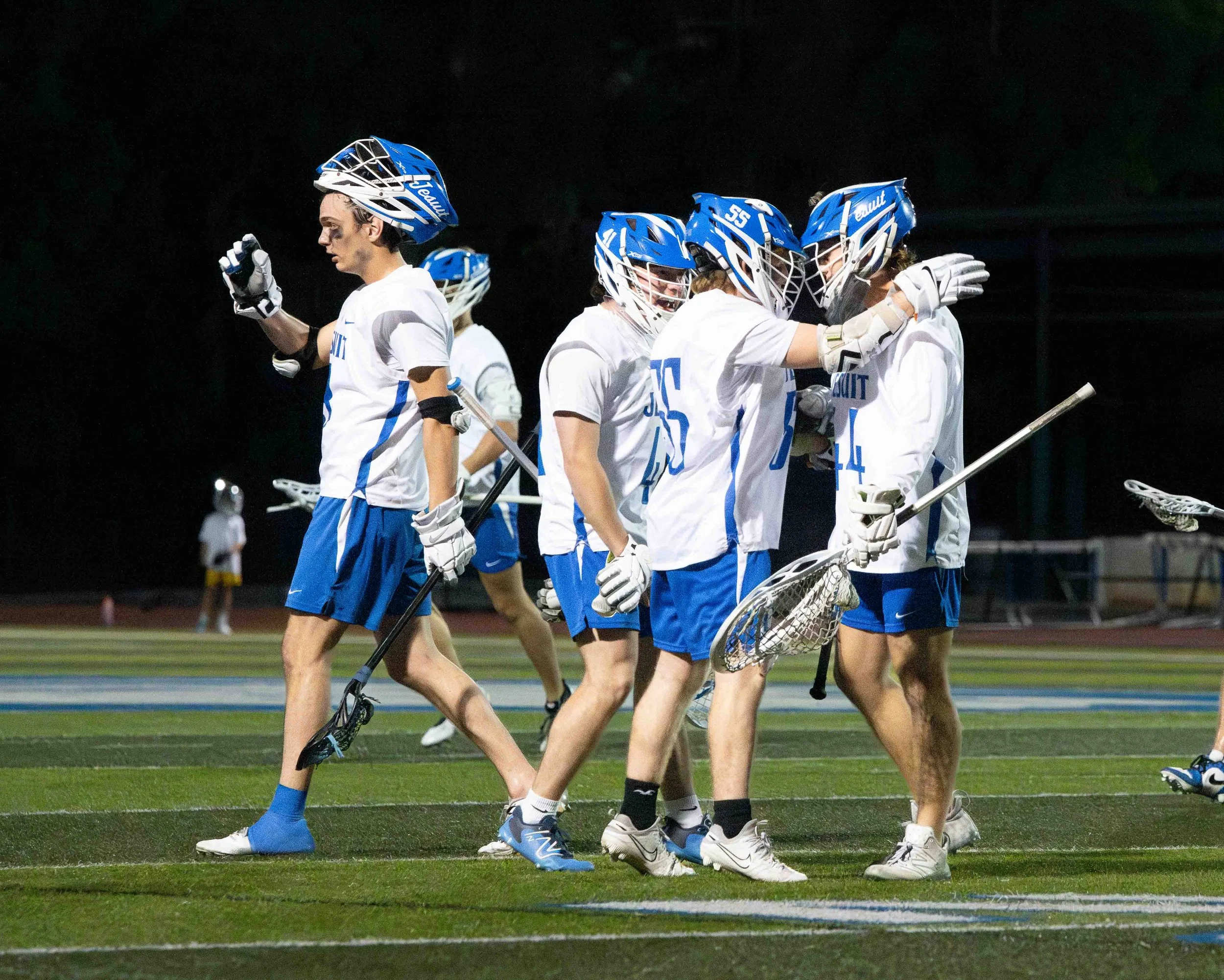 Run Out Jesuit Lacrosse Players L-6.jpg