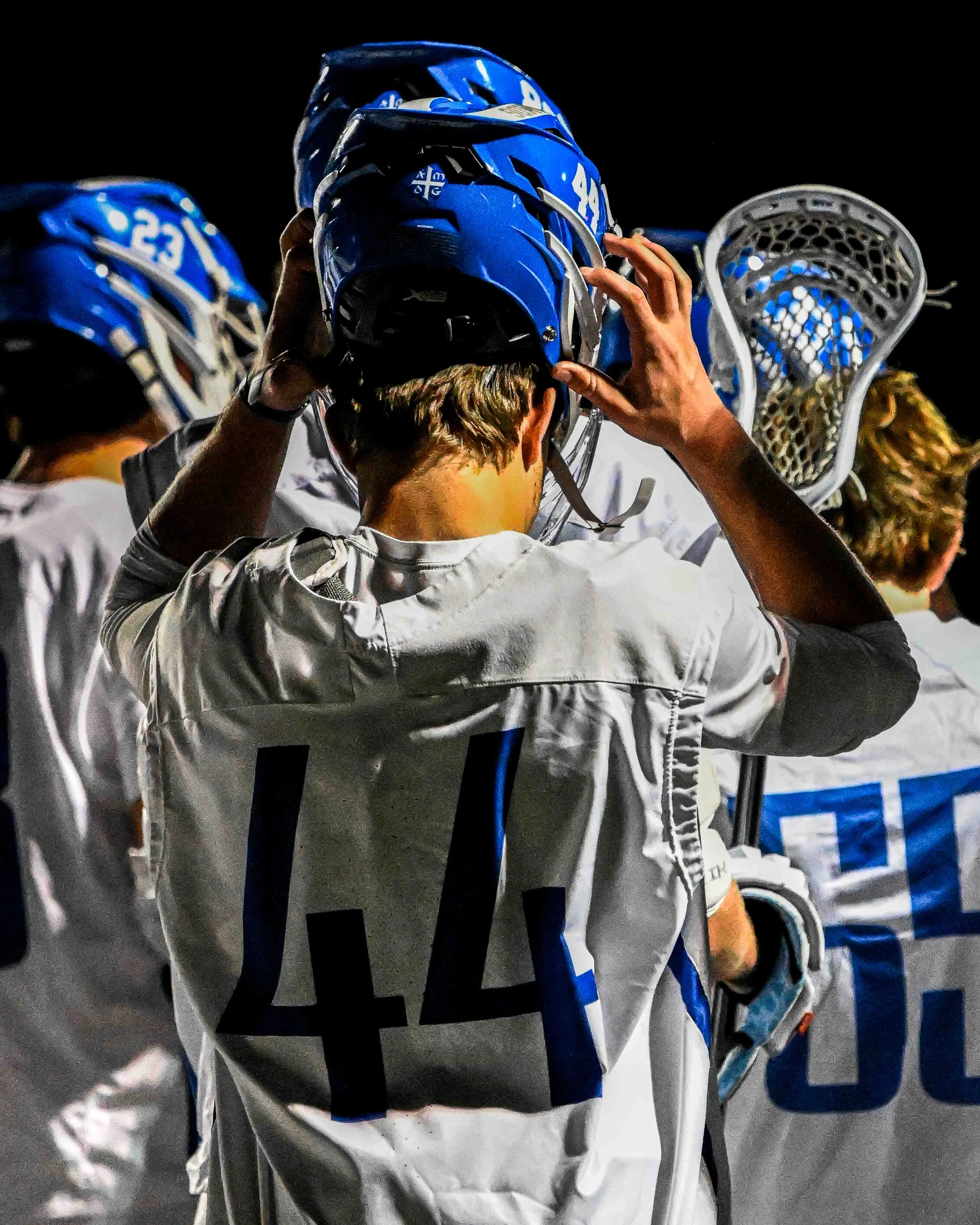 Lacrosse-Goalie-Puts-On-Helmet.jpg