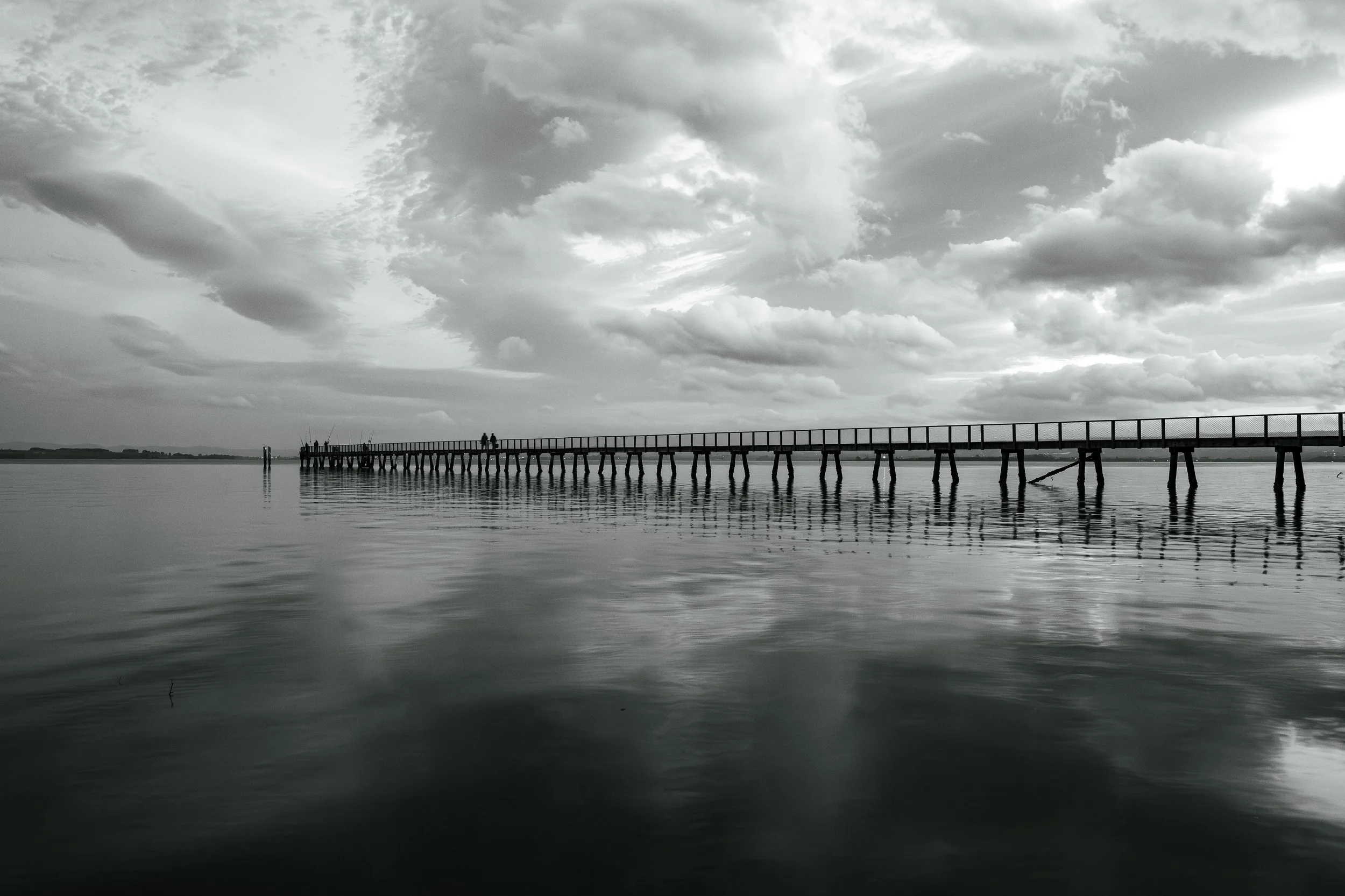 Kauri Point Jetty with passing storm clouds
