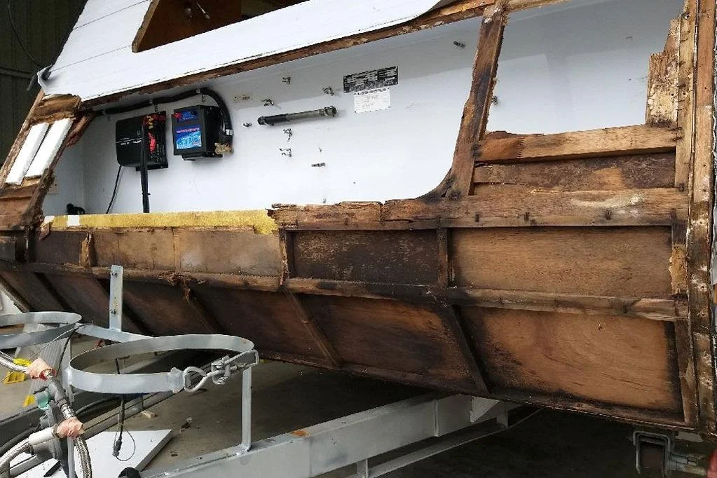 A damaged caravan suffering from wood rot