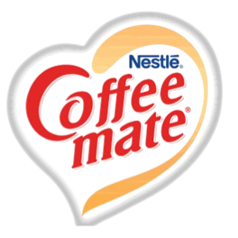 A neon heart-shaped sign with the text 'Coffee Mate' inside.