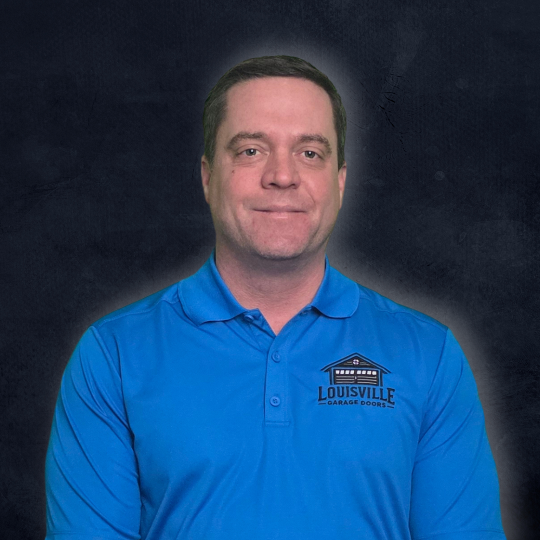 A man in a blue polo shirt with Louisville Garage Doors logo, standing against a black background.