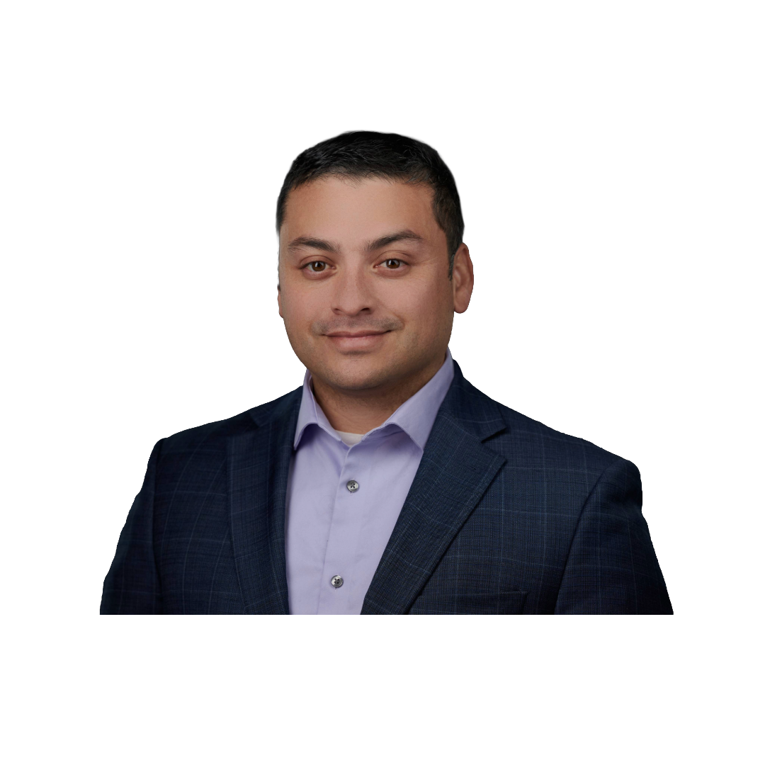 Headshot of a man wearing a dark checkered blazer and light purple shirt, smiling slightly against a black background.