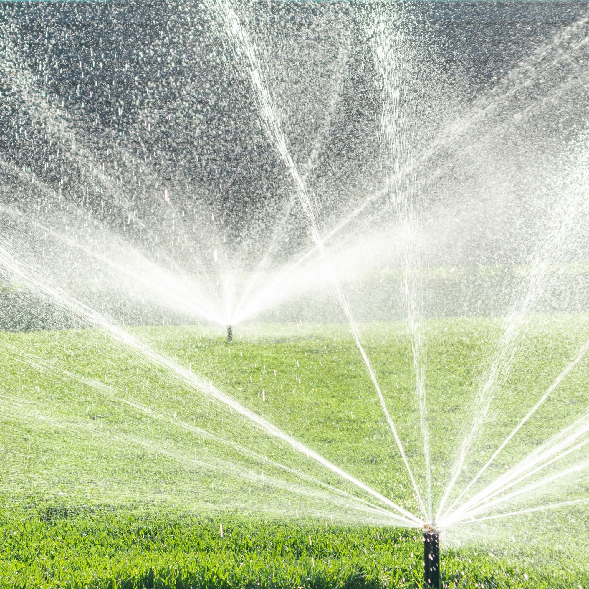 Sprinkler system watering lawn