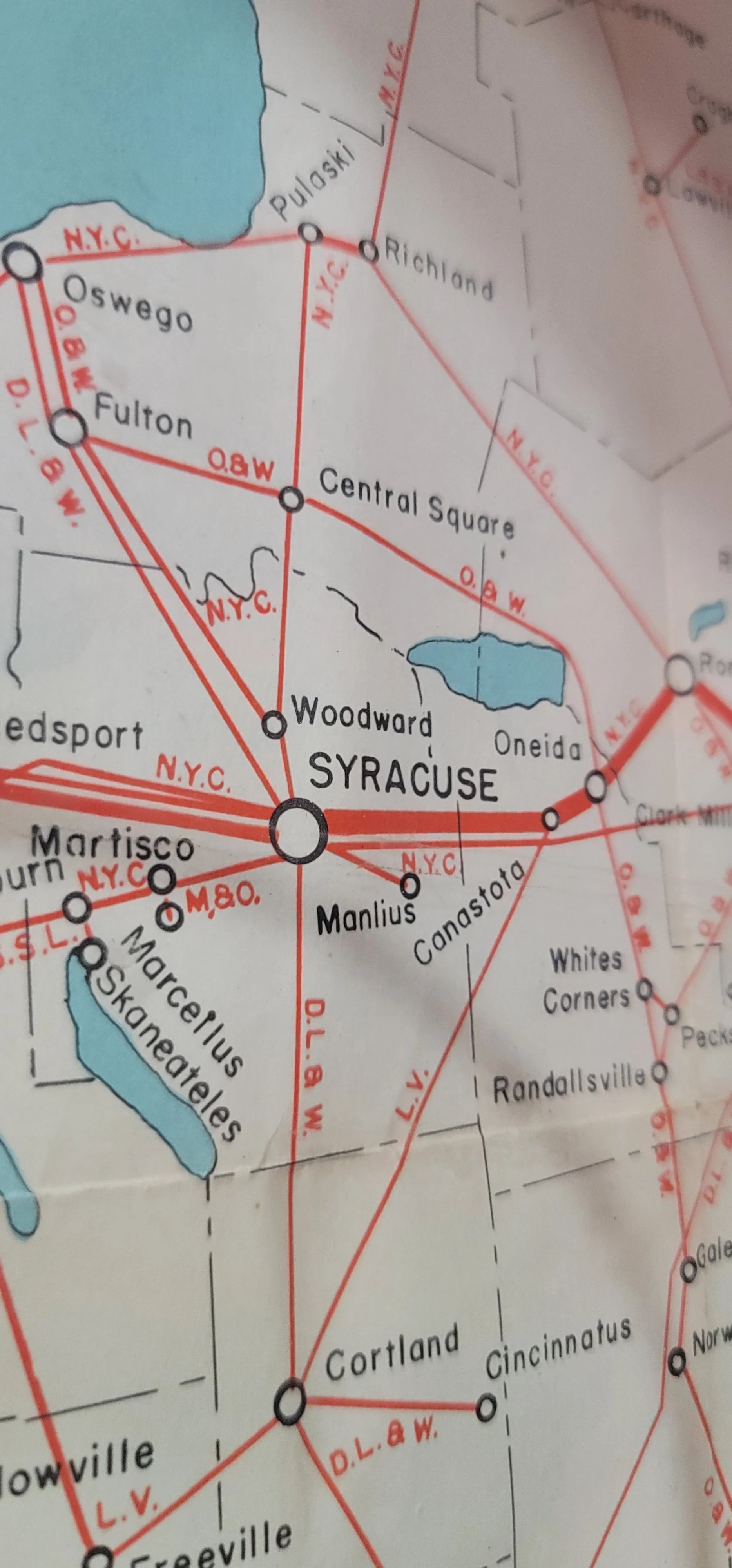 Map of New York state showing Syracuse and surrounding towns and cities with red lines and labels.