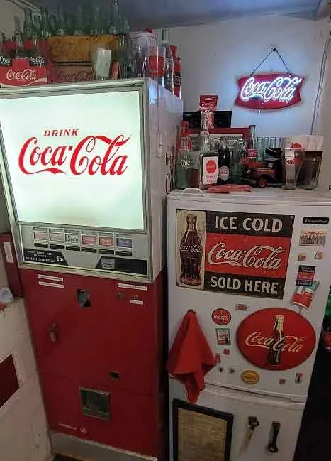 1965 working vending machine with coin sorter mechanism, plus original electrical schematics too. Tons of classic glass coke bottles from different bottling facilities across the country. (I’m trying so hard to find a classic bottle from Blakely, Geo