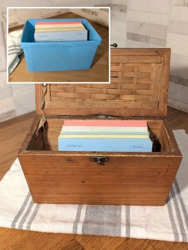 Vintage wooden recipe box with colour-coded recipe cards and inset of old blue plastic diaper wipes box used for 23 years