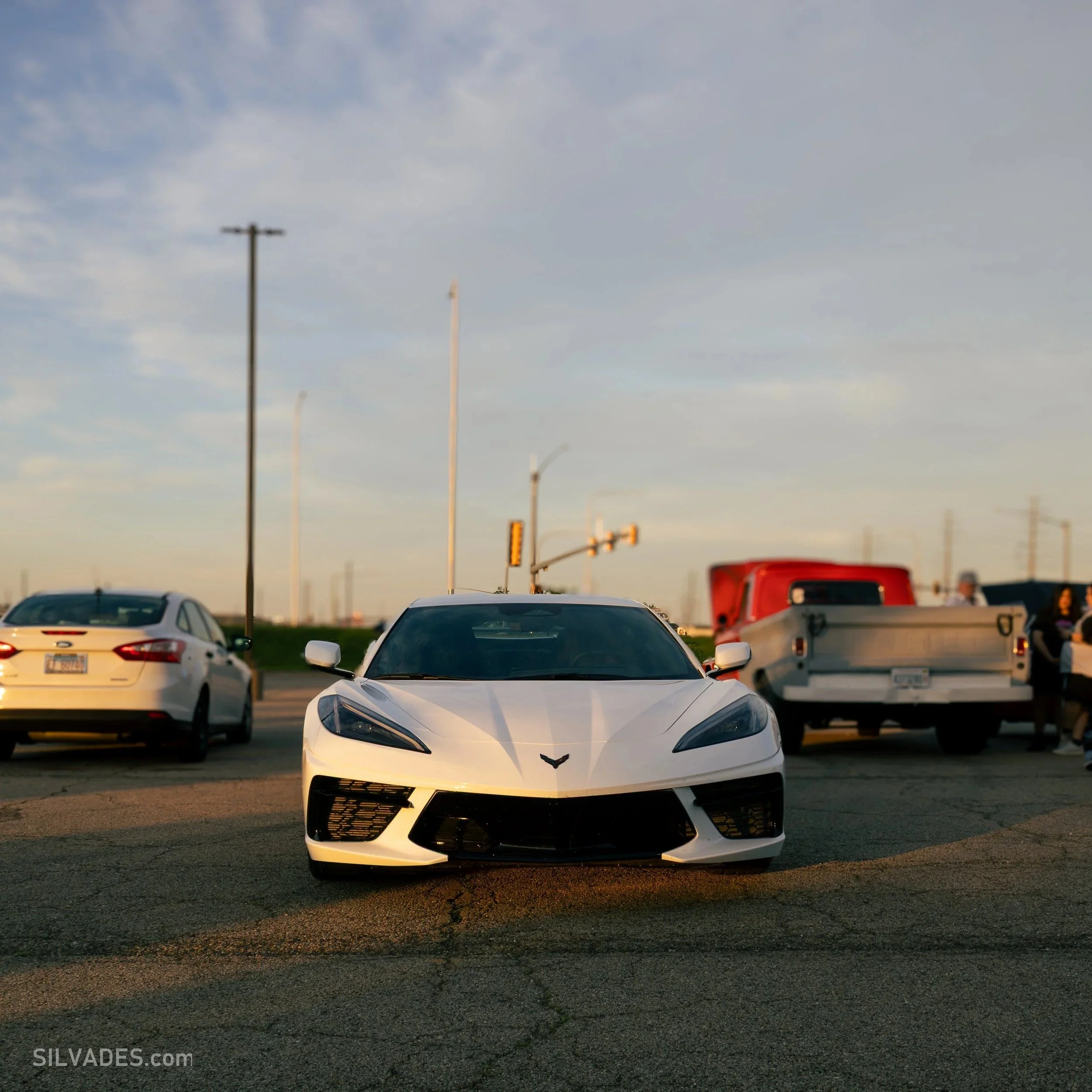 White Corvette photographed at dusk