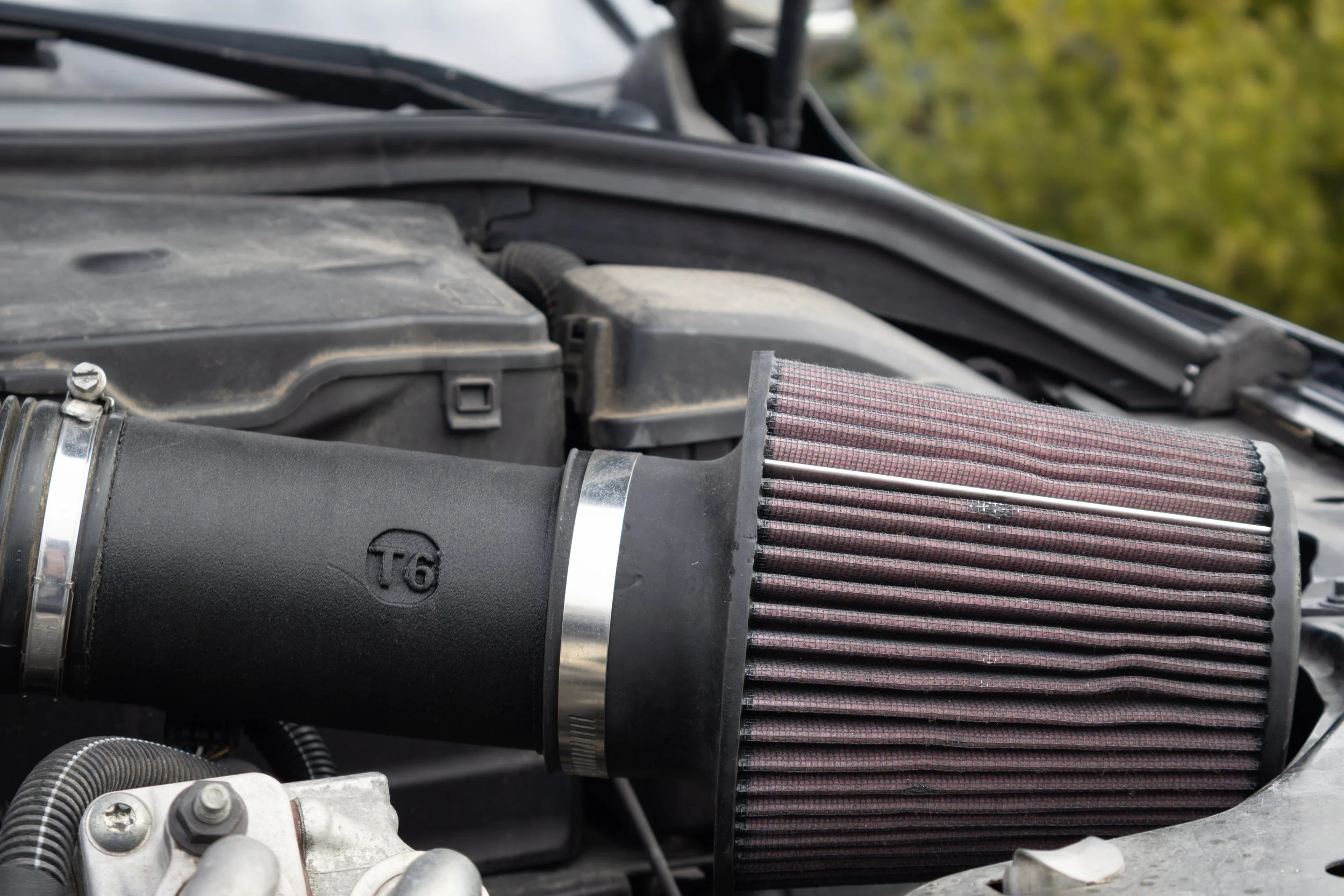 SilvaDes T6 intake installed, logo detail with the cone filter