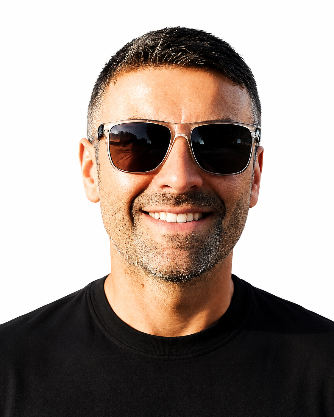 A smiling man wearing black sunglasses and a black t-shirt.