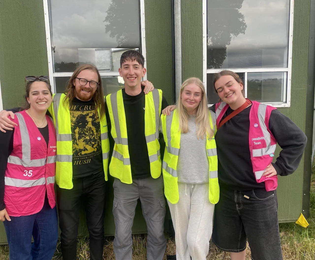 Event team members standing together on site, reflecting collaboration and teamwork during event operations.