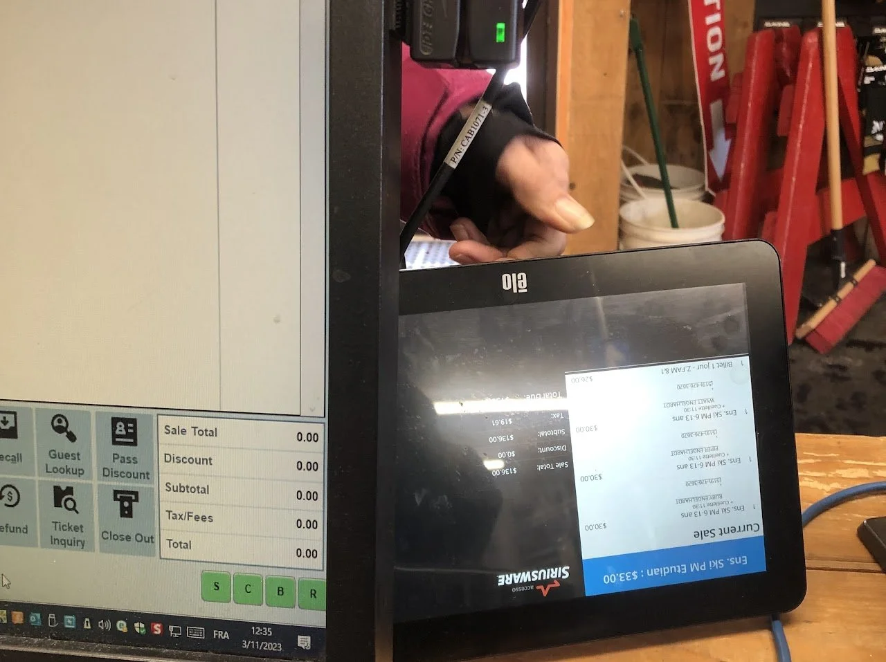 Processing a transaction using a point-of-sale system as part of box office and on-site event operations.