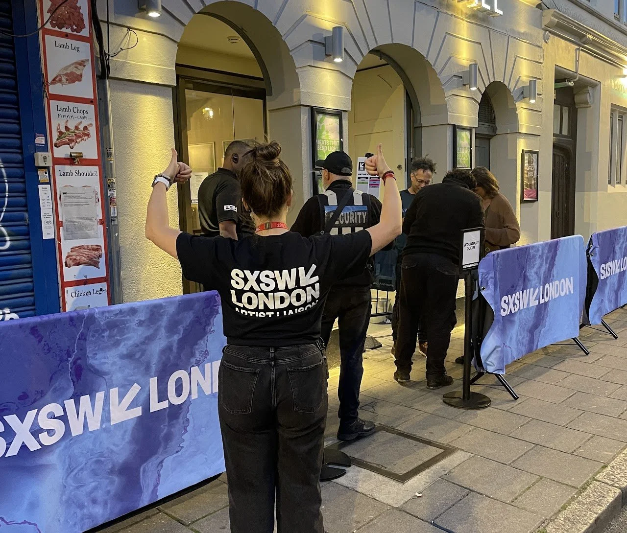 Working as artist liaison at SXSW London, coordinating access and supporting artists and security at a venue entrance.