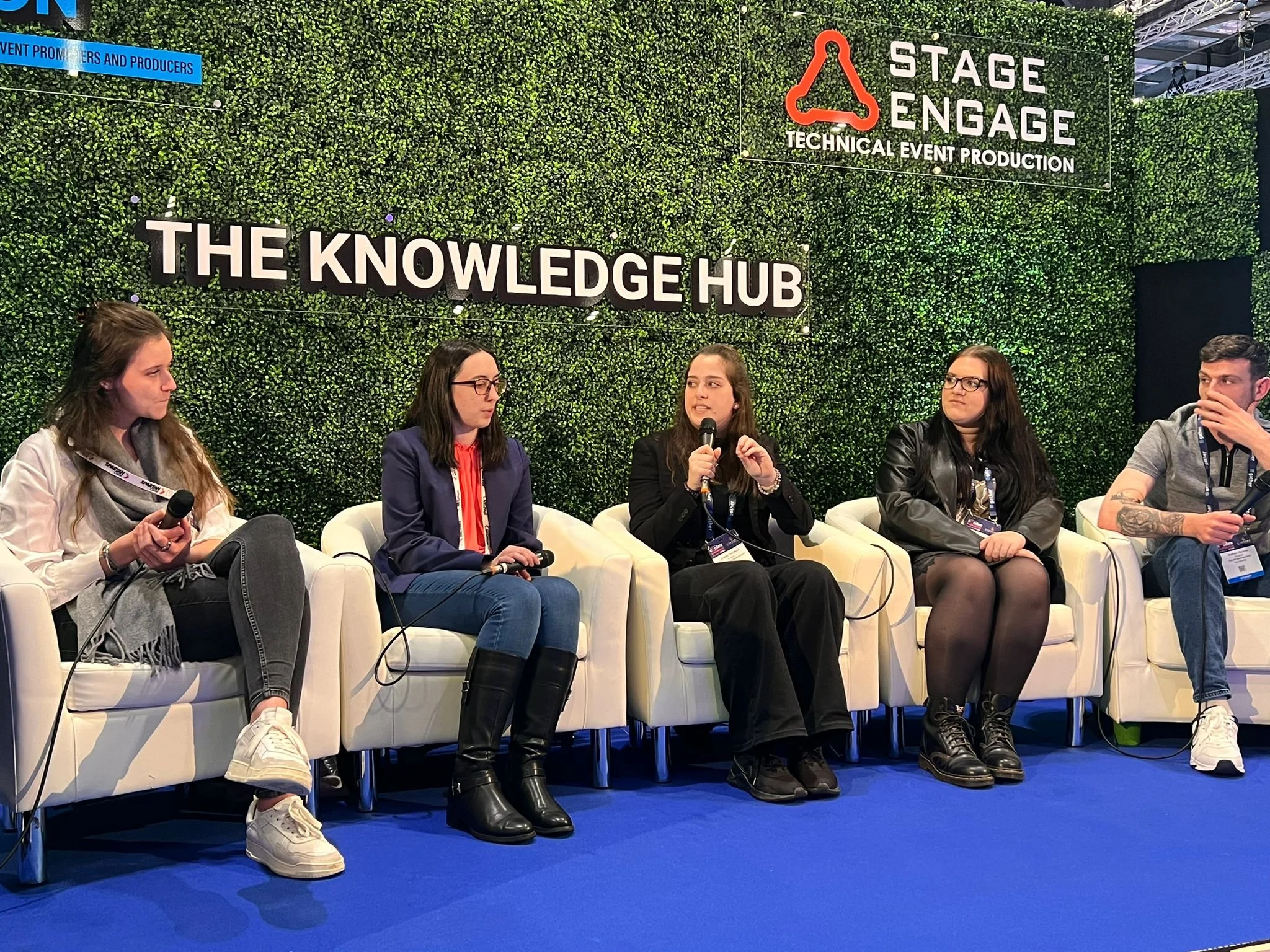 Event professional speaking at a panel on event management degrees