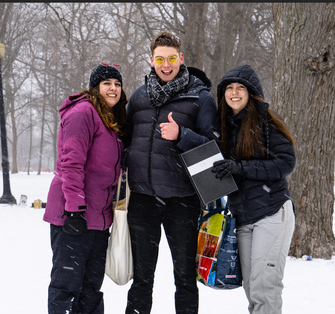 Team moment outdoors during a winter event, celebrating collaboration and shared effort in challenging conditions.