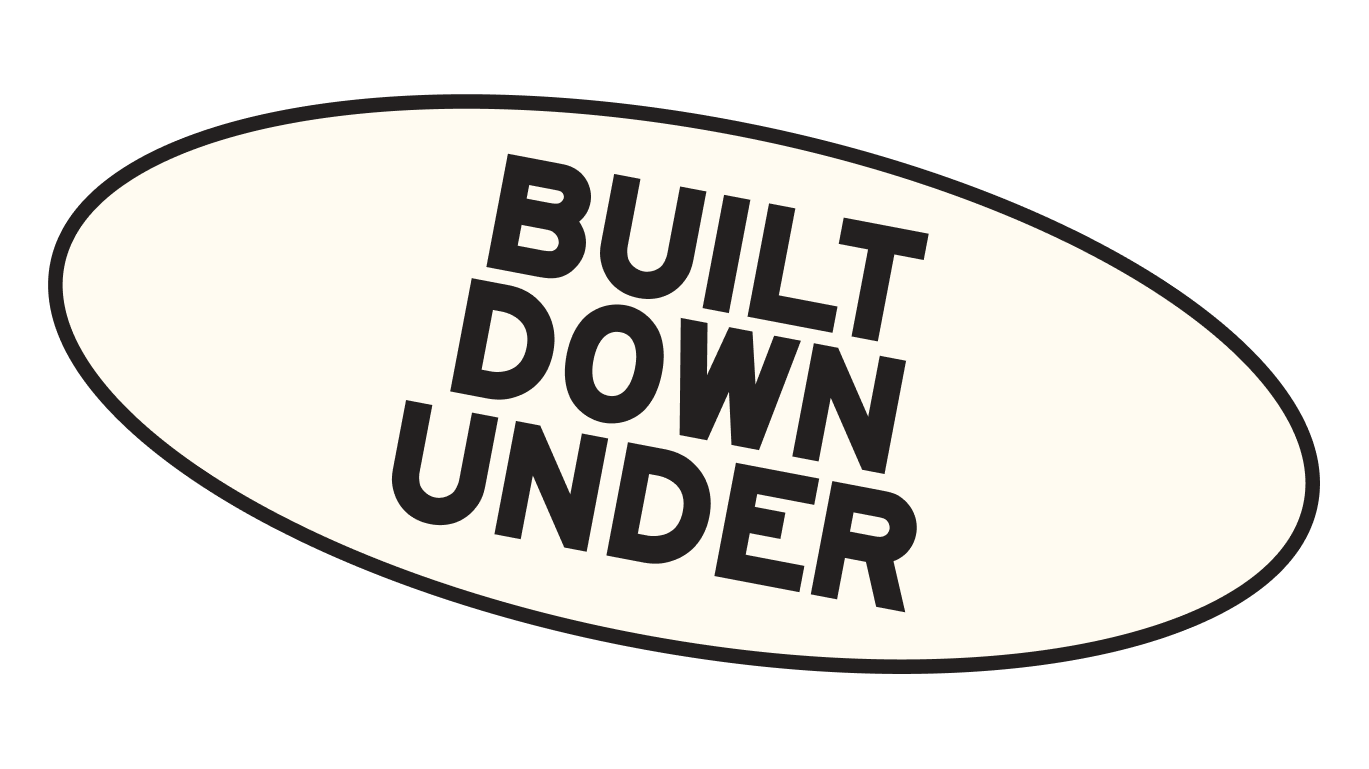 Oval sign with the text 'Built Down Under' in black letters.