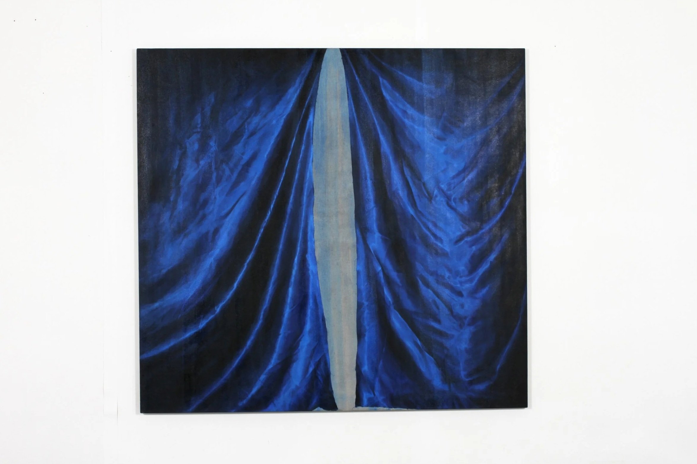 Abstract painting of deep blue and black folds resembling draped fabric with a central light gray streak.