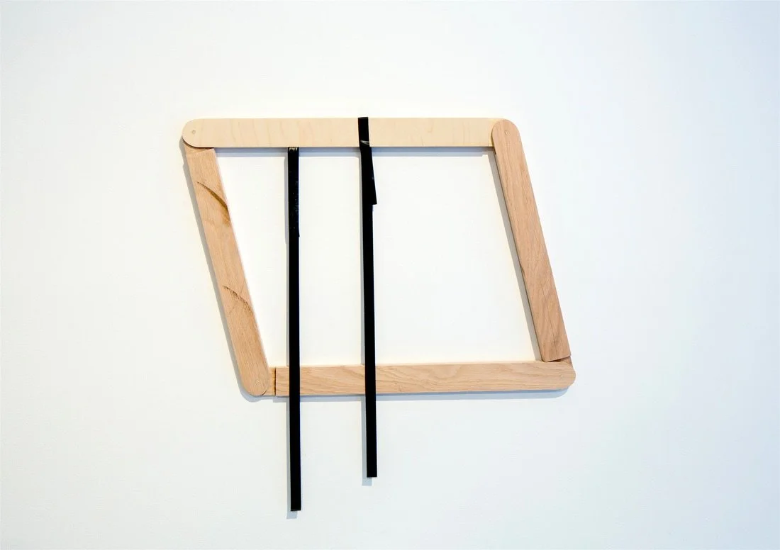 Wood and black metal music stand on a white background